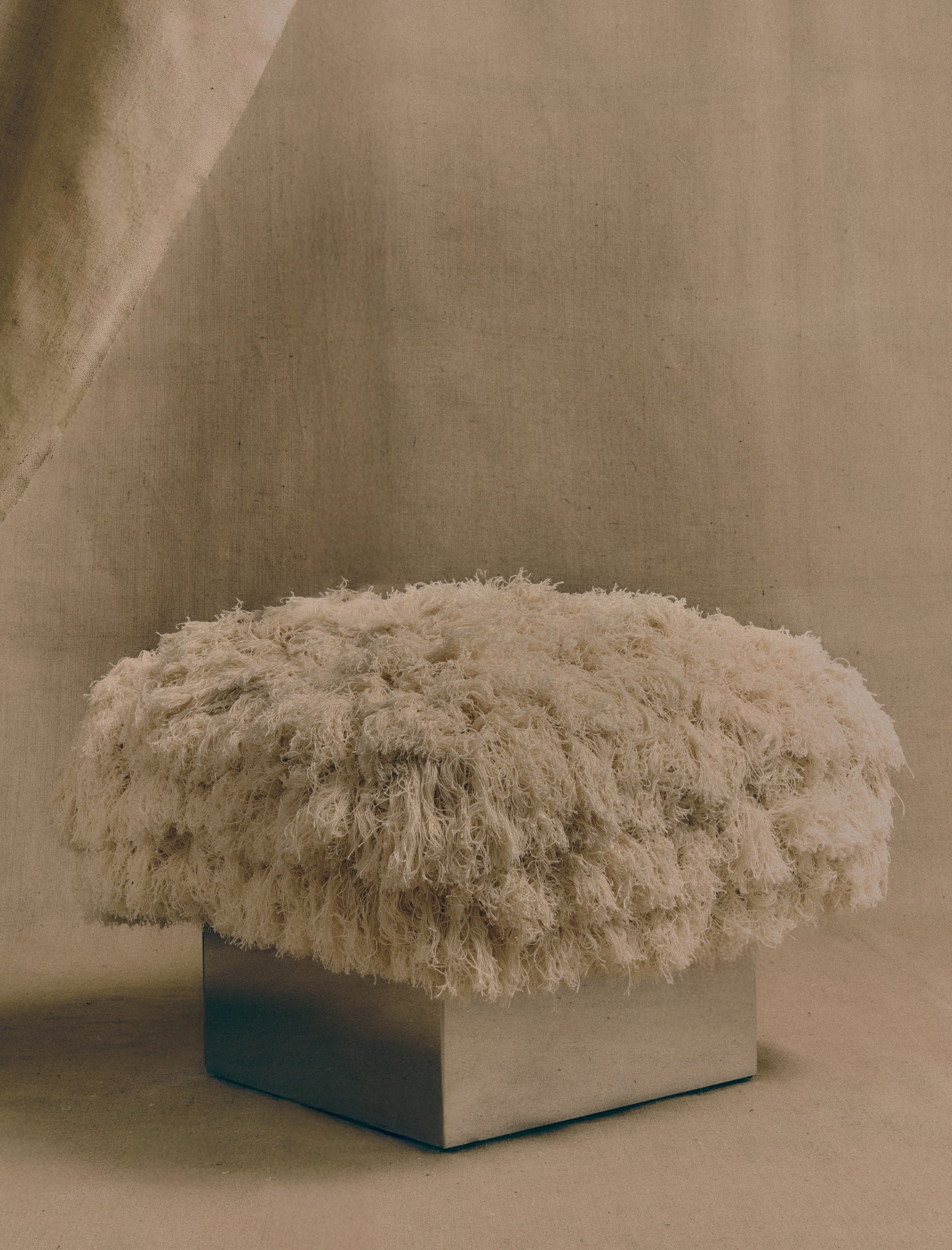 The CLIFTON IN FRAY ottoman - Curación Collection
