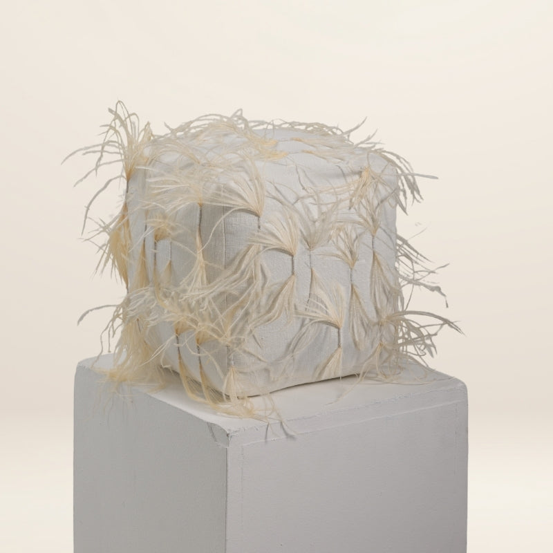 The CUBE scatter in feathers