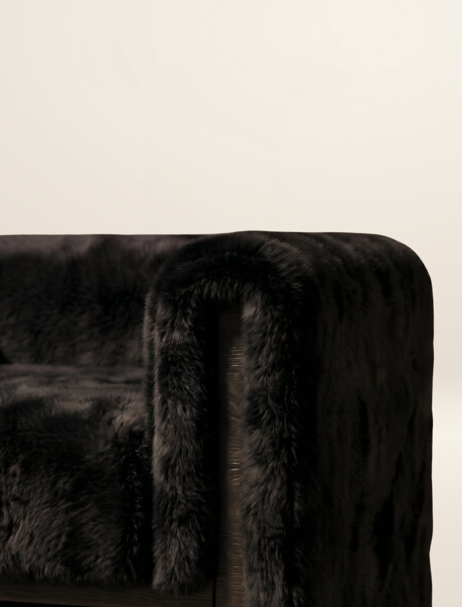 The SOCIALÉ occasional chair, in char shearling on chocolate wood