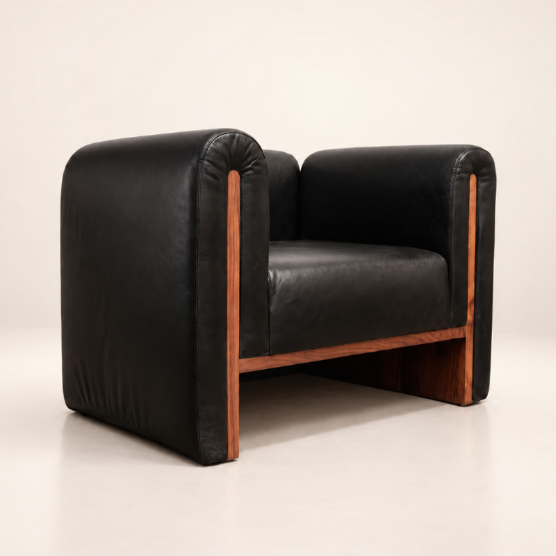 The SOCIALÉ occasional chair, in char leather and tobacco wood