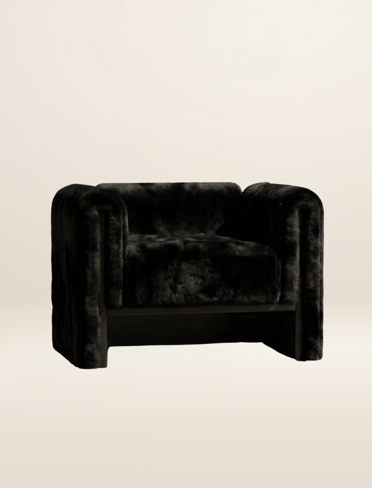 The SOCIALÉ occasional chair, in char shearling on char wood