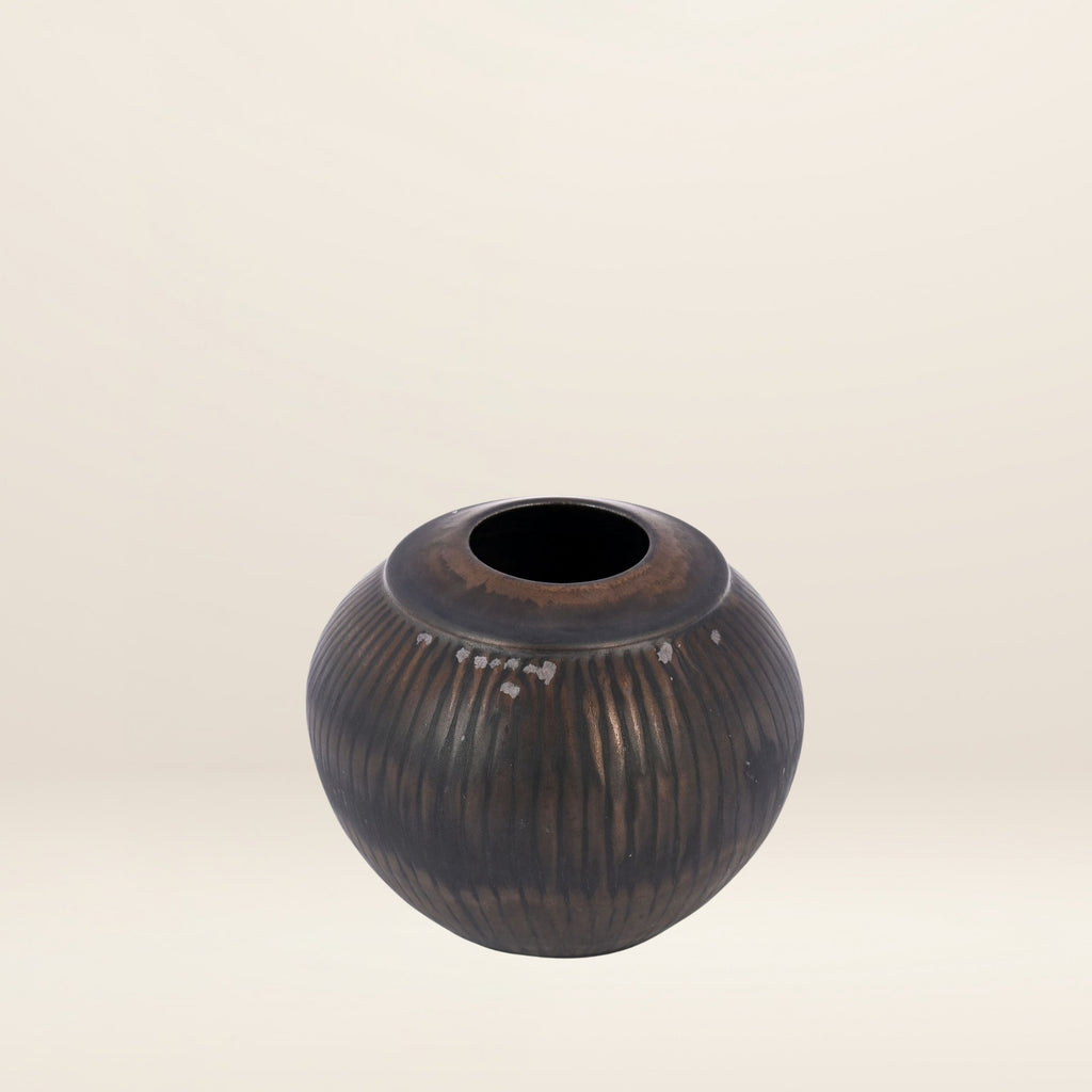The STRIATED GLOBULAR vase by Thelma Marcuson