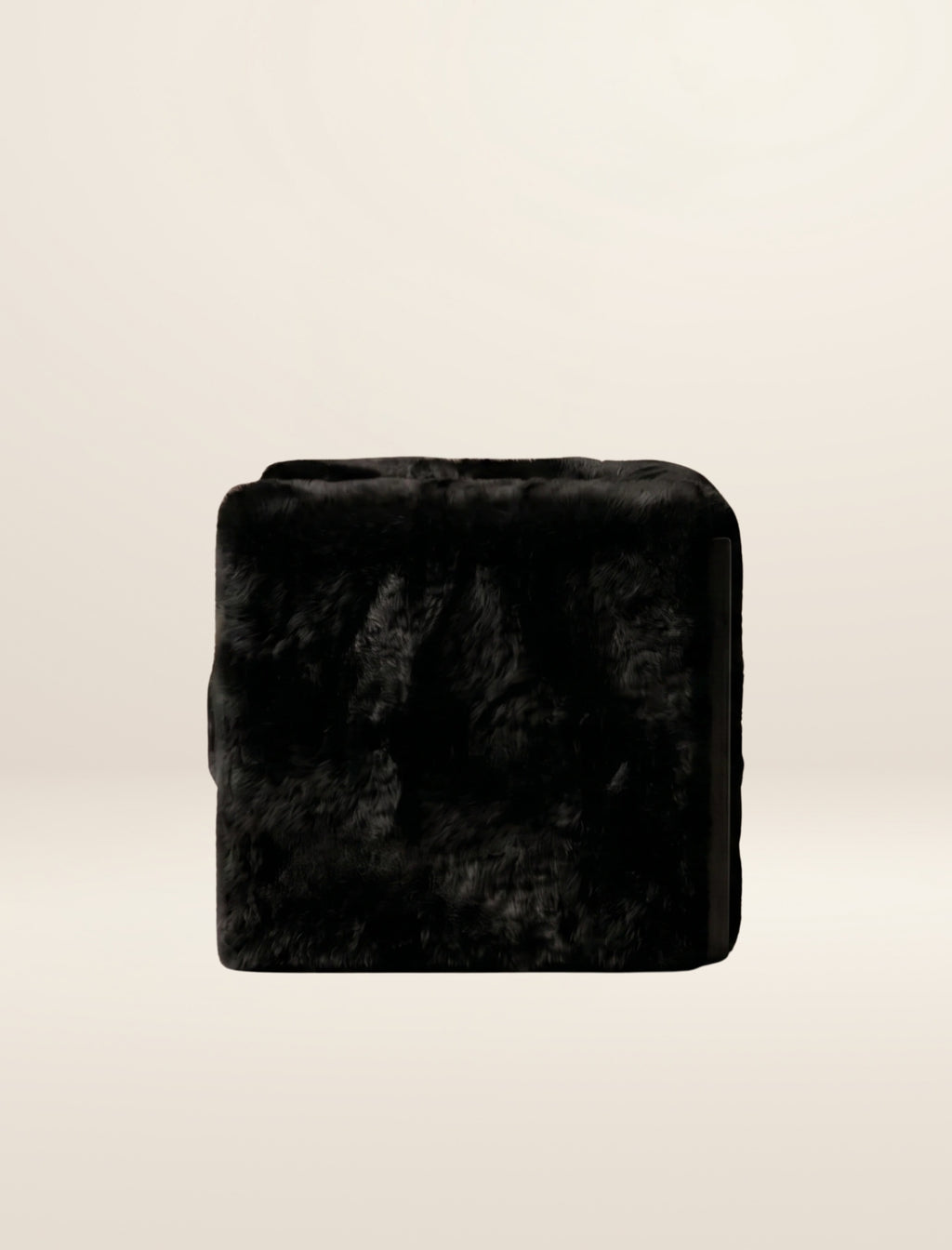 The SOCIALÉ occasional chair, in char shearling on char wood