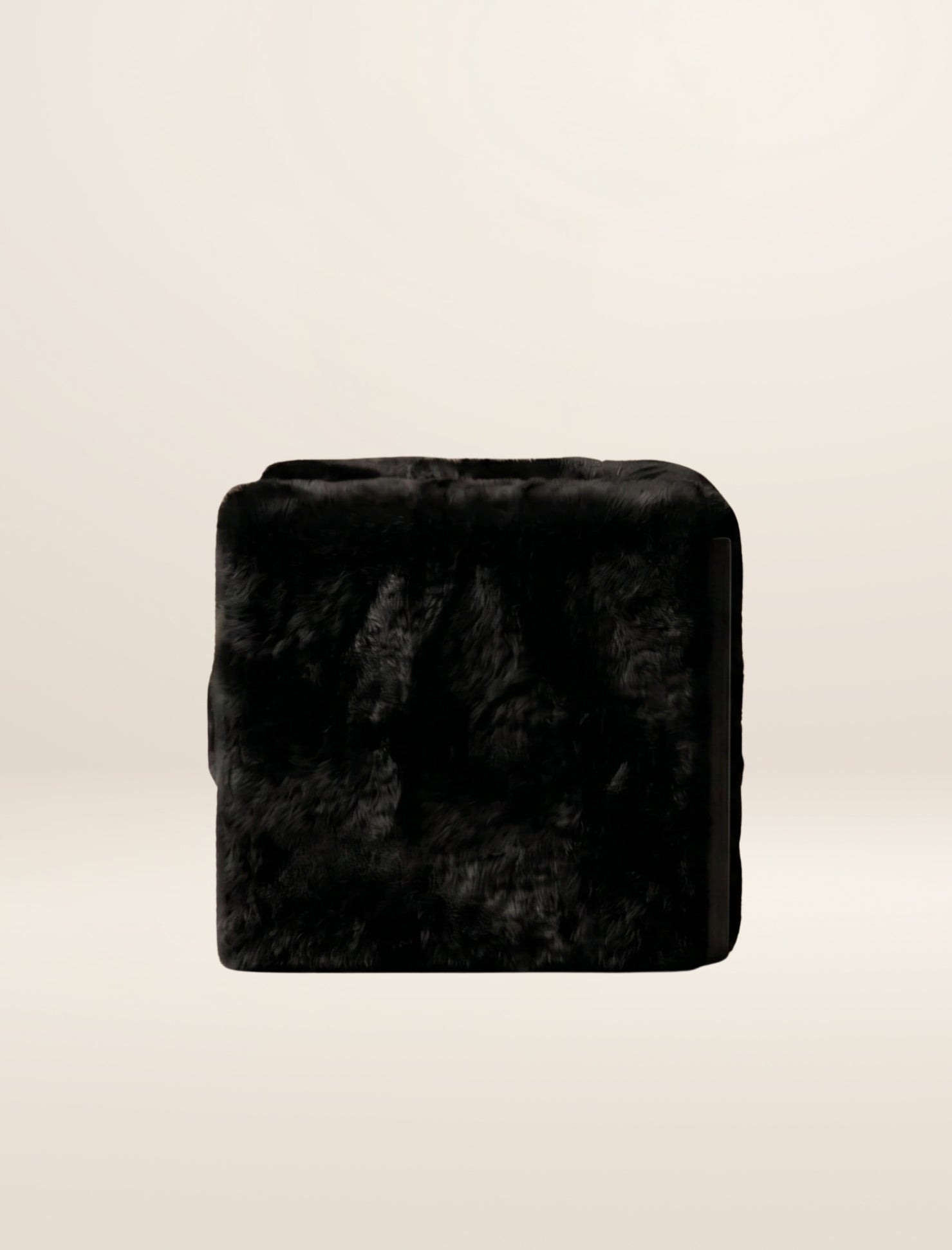 The SOCIALÉ occasional chair, in char shearling on char wood