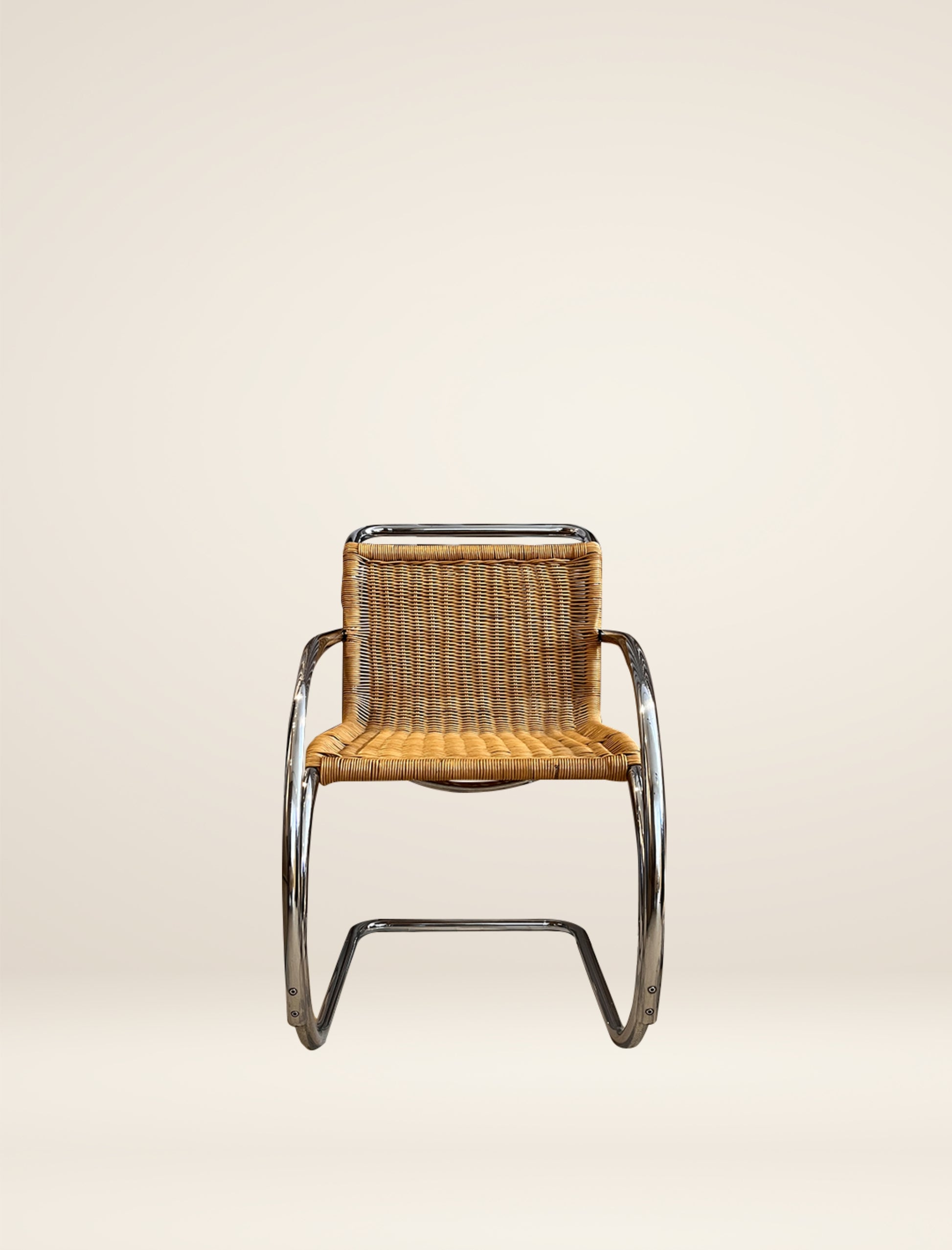 The MR20 chair in rattan and chrome
