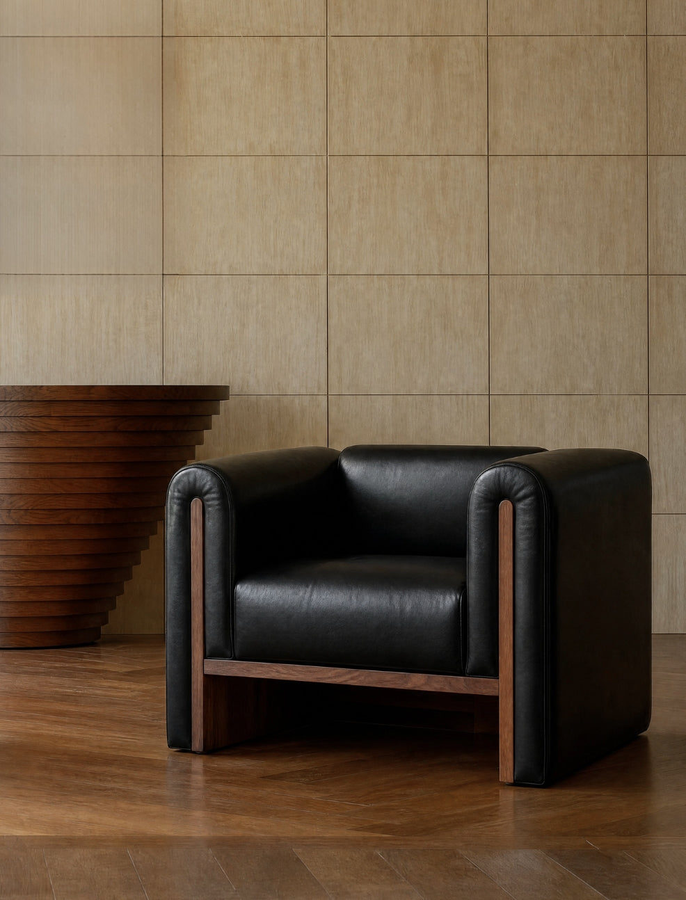 The SOCIALÉ occasional chair, in char leather and tobacco wood