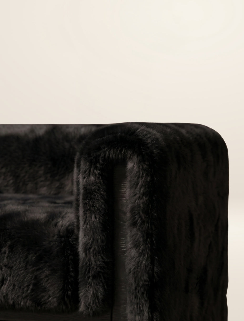 The SOCIALÉ occasional chair, in char shearling on char wood