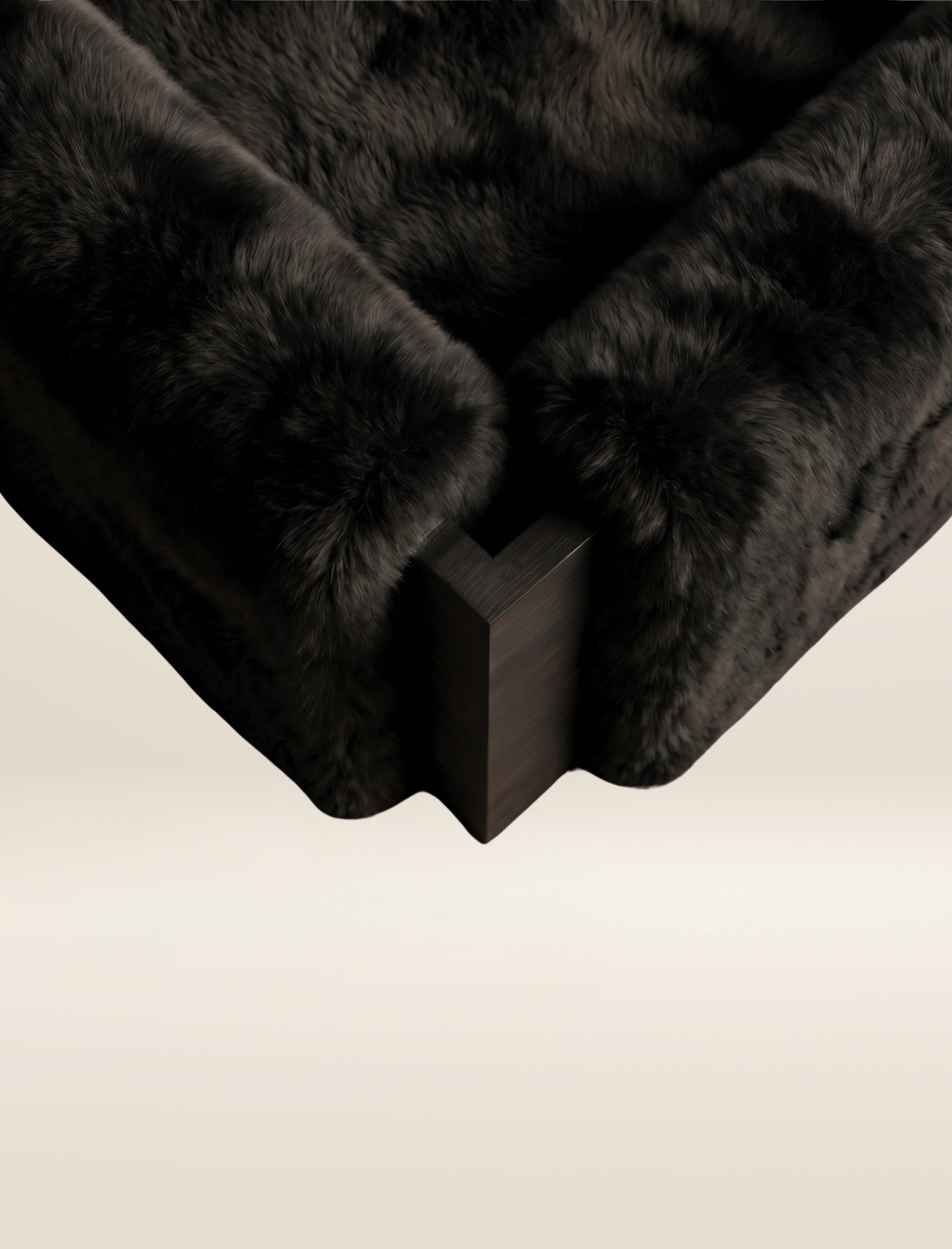 The SOCIALÉ occasional chair, in char shearling on char wood
