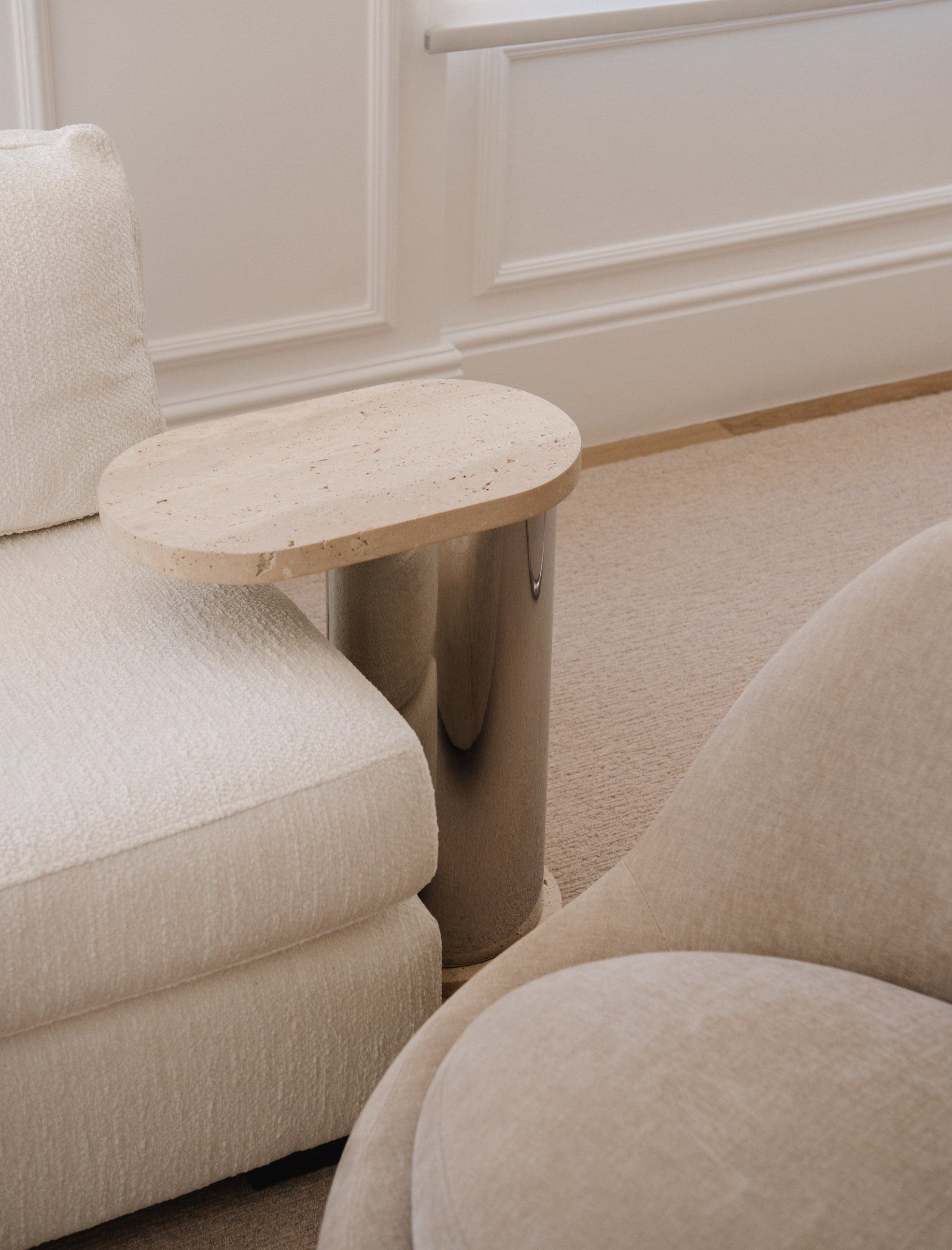 The SOMETHING ON THE SIDE side table in travertine