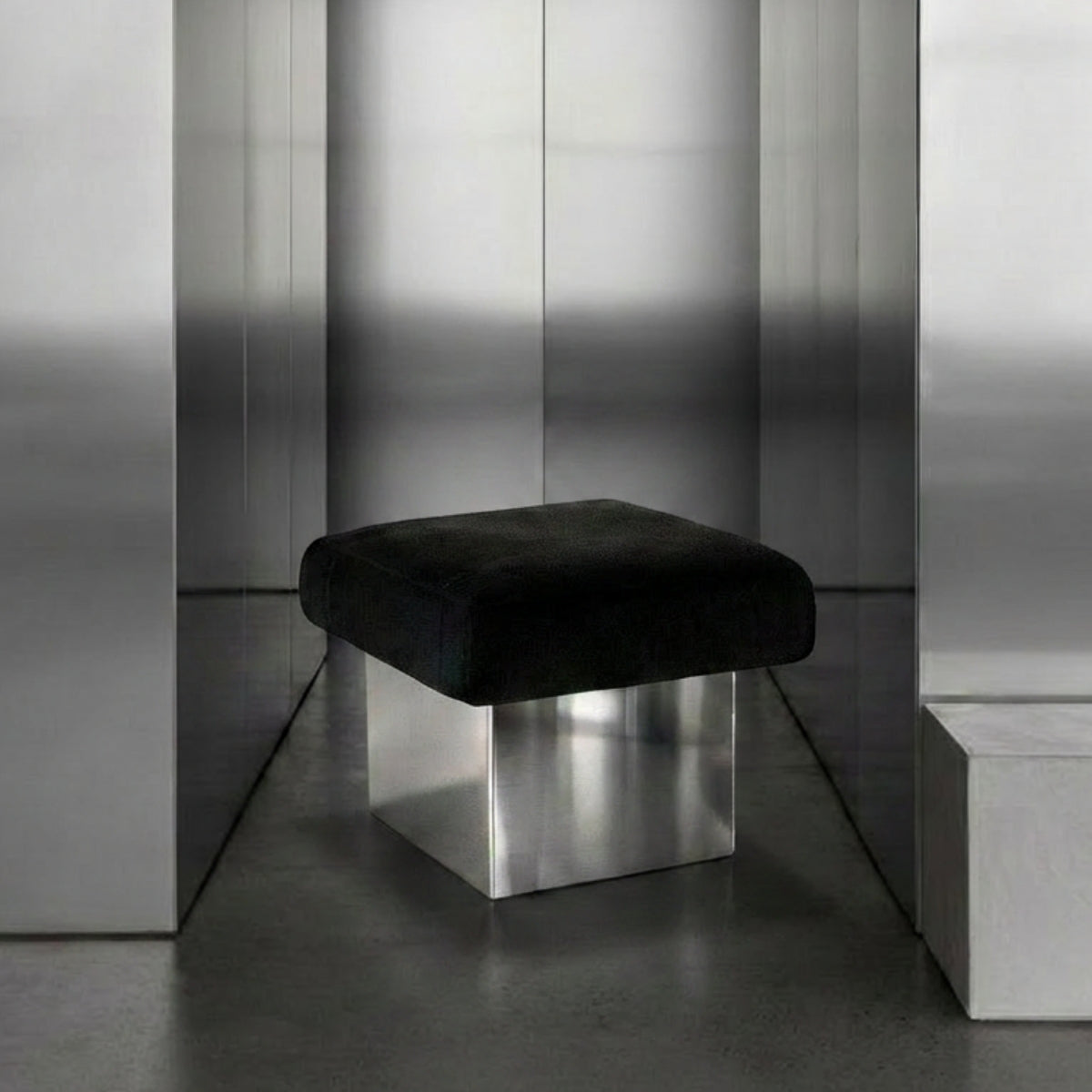 The CLIFTON IN BALANCE ottoman in stainless steel and char