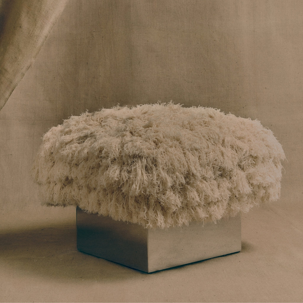 The CLIFTON IN COUTURE fray ottoman