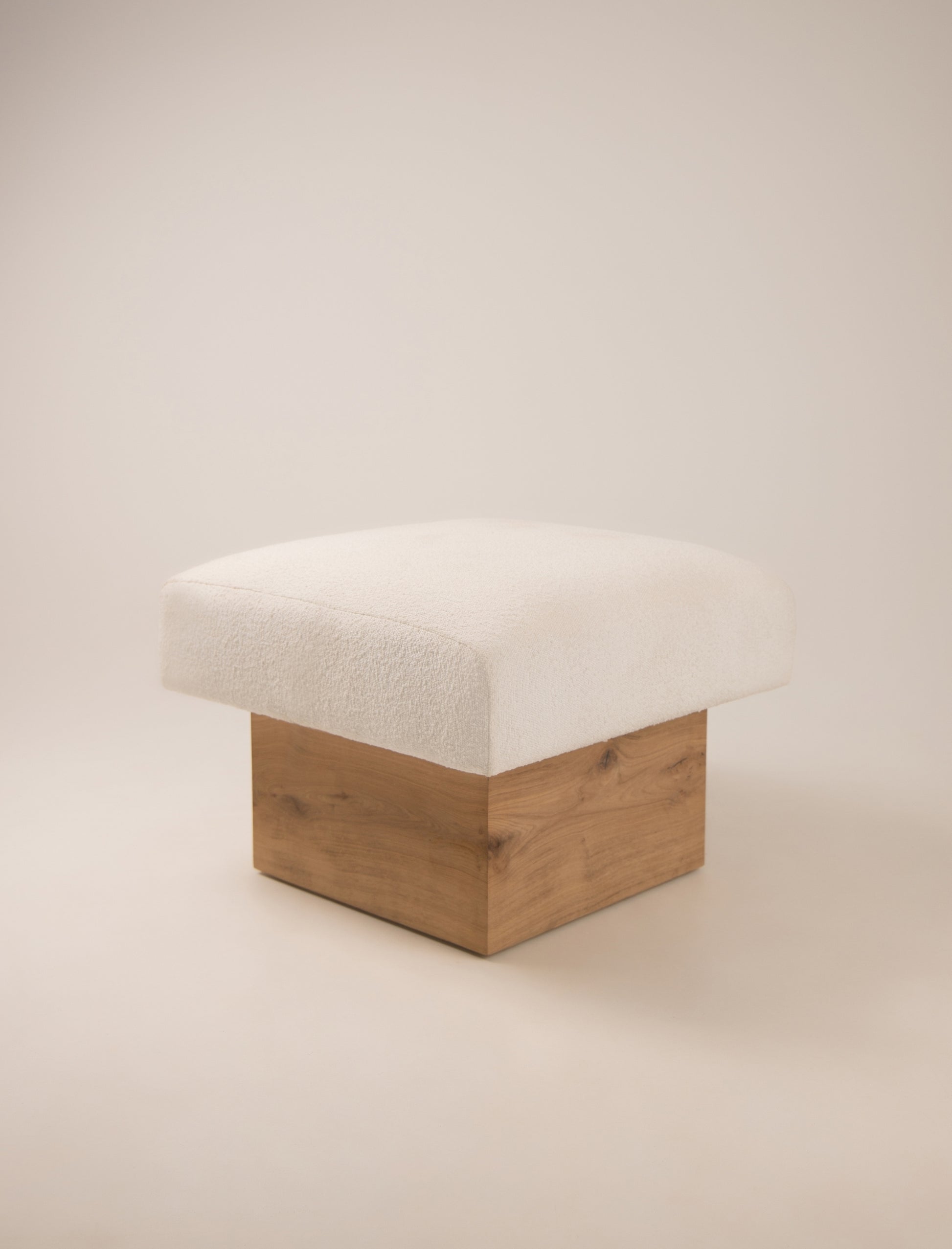 The CLIFTON IN BALANCE OTTOMAN in oak