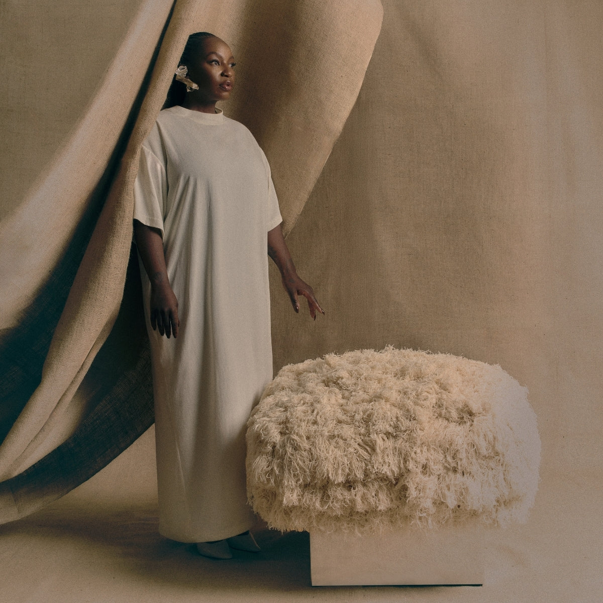 The CLIFTON IN COUTURE fray ottoman