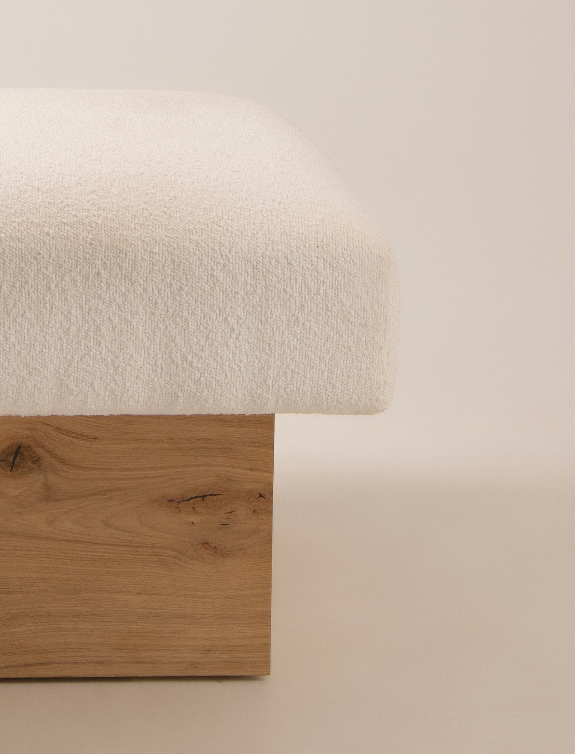 The CLIFTON IN BALANCE OTTOMAN in oak