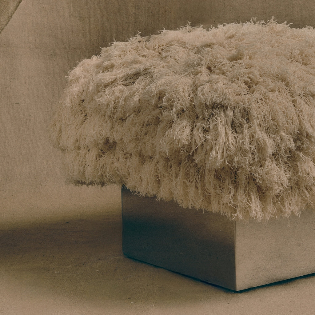 The CLIFTON IN COUTURE fray ottoman